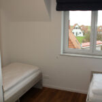 Ferienhaus in Wremen - Schlafzimmer mit Einzelbett