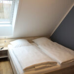 Ferienhaus in Wremen - Schlafzimmer mit Doppelbett